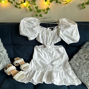 Selling this cute white dress, with waist showing on the side and puffy sleeves.